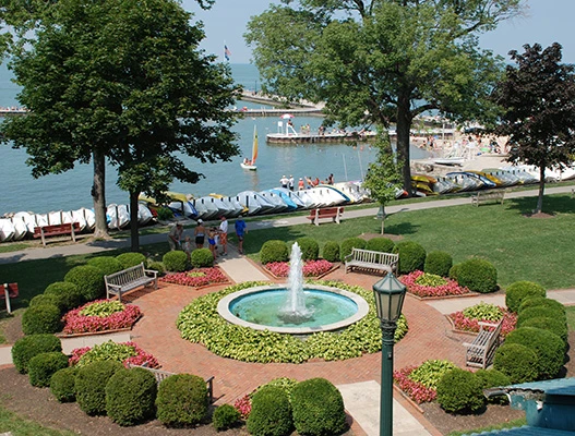 aerial view of water fountain surrounded by hedges