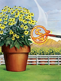 An oversized pot of flowers sits on a field near a fence.