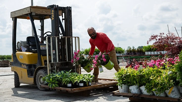 A team member of Loma Vista Nursery in Ottawa, Kansas, loads stock.