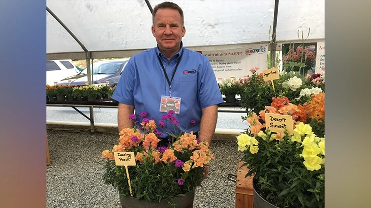 Joe Messer with Dazzling Peach, a combination of snapdragon and verbena