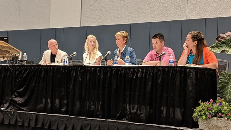Six people sit at a table.