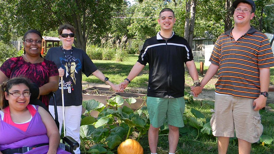 The Capper Gardens (shown here) consist of raised beds on a corner of their Topeka, Kansas campus, as well as raised and flat garden beds including many sensory components in their inner courtyard and container gardens at their residences. 