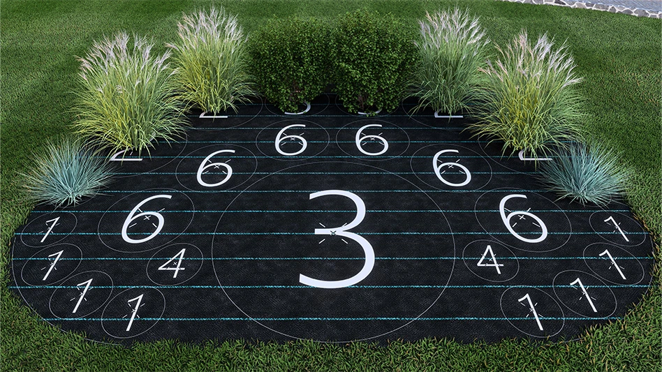 A large black piece of fabric printed with white numbers. Located at the top of the fabric are green grass-like plants.
