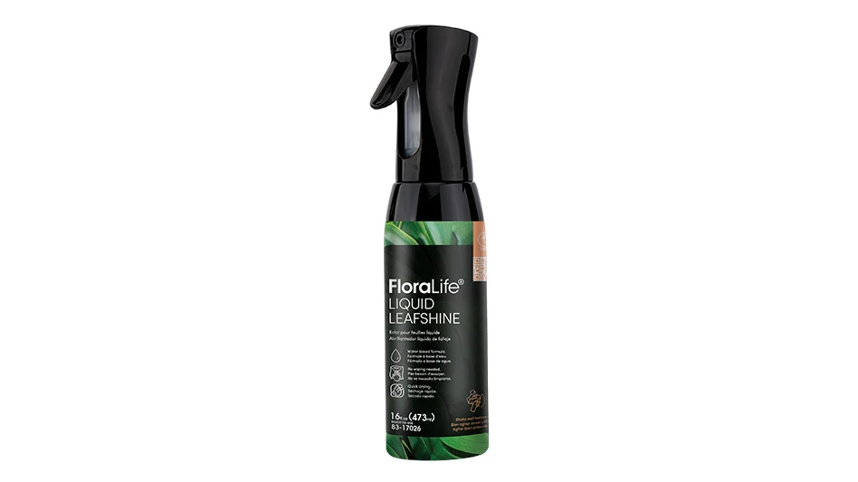 A black spray bottle with a white, green and black label.