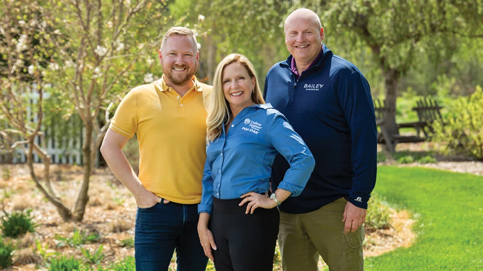 Three smiling people.