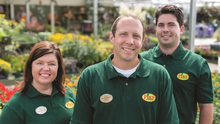 Pike Nurseries employee group shot in green shirts